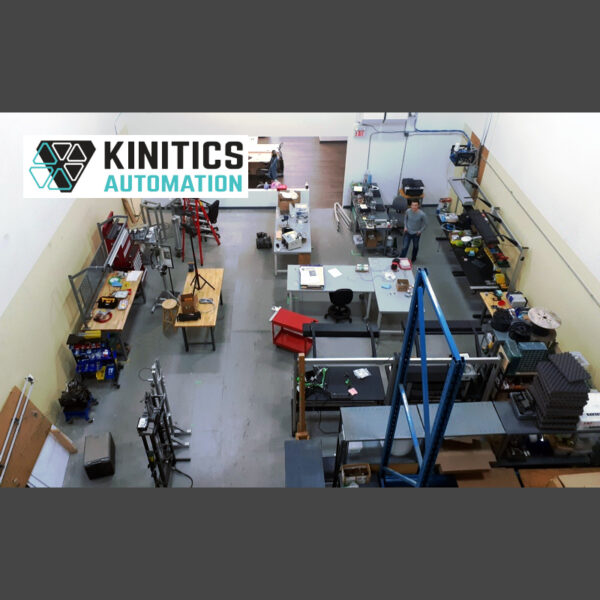 Kinitics Automation shop with workbenches, karting event photo wall